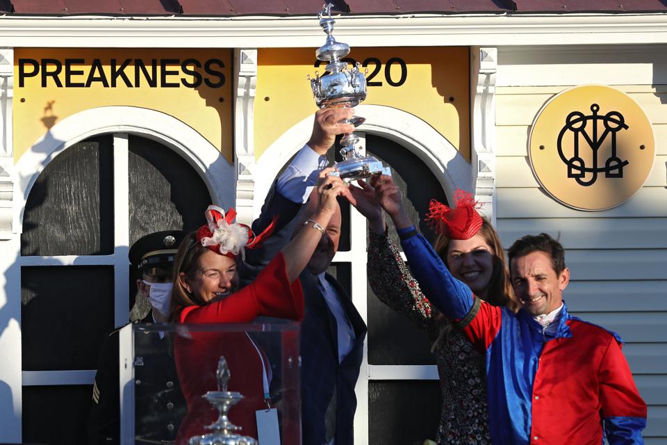 Good Holding trophy over head
